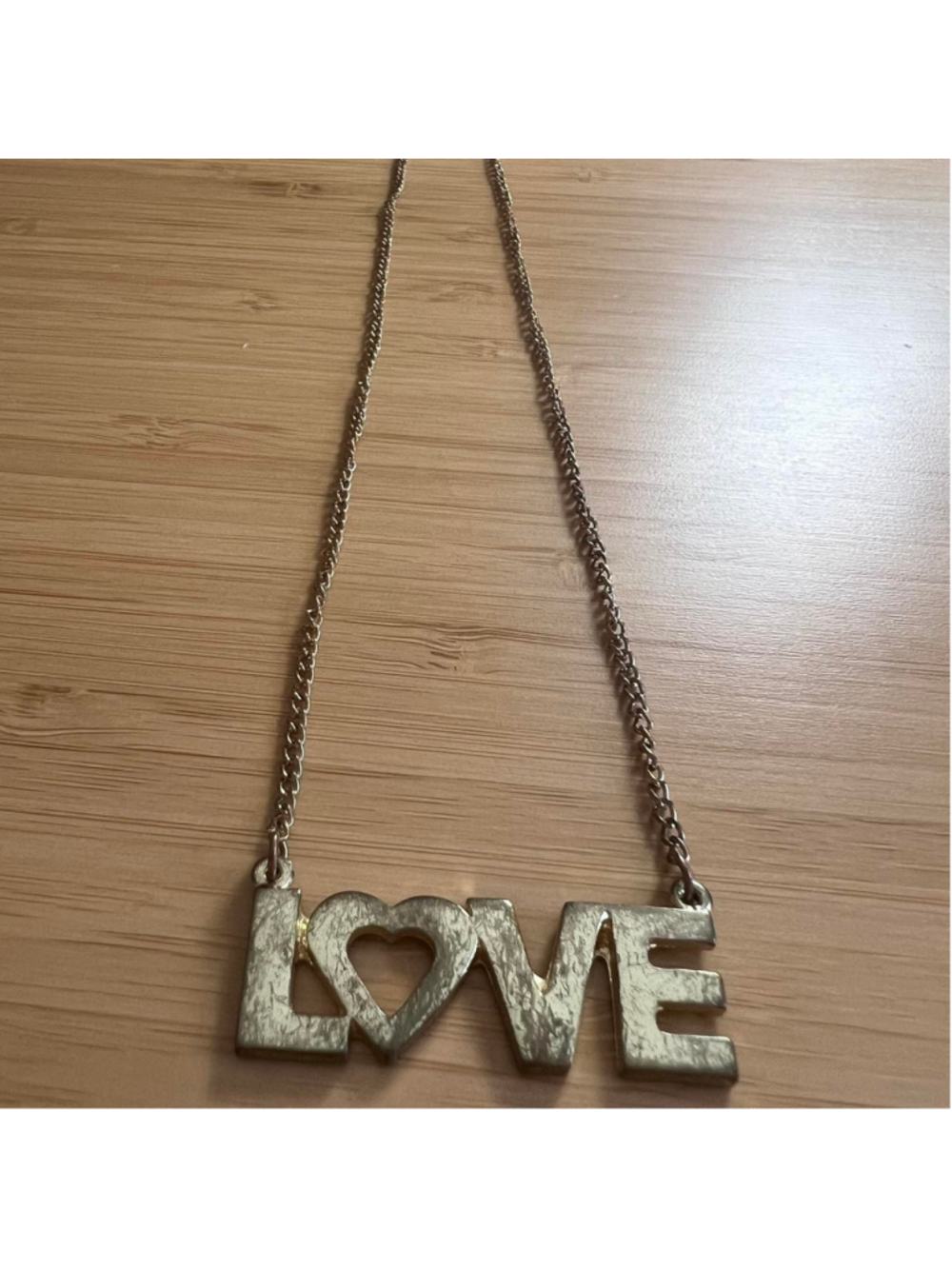 Vintage-looking gold ‘LOVE’ necklace